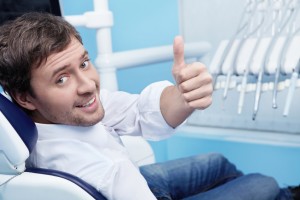 Happy patient visiting the dentist Spring Lake residents prefer