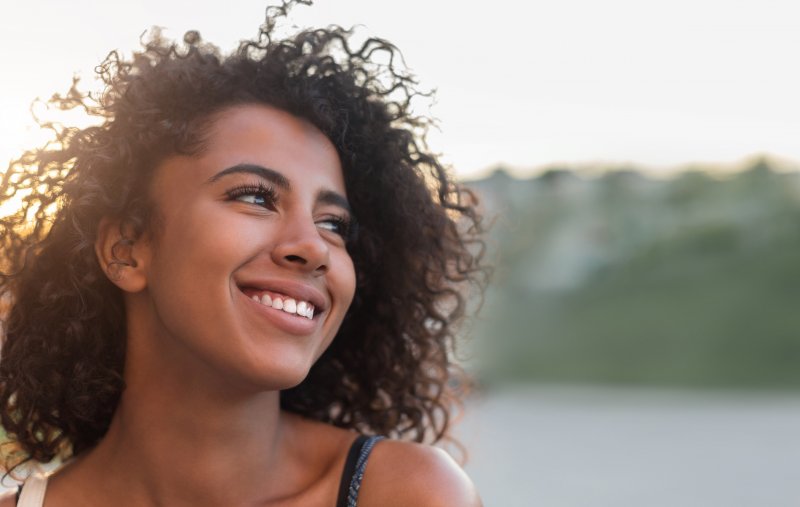 girl smiling outdoors during summer