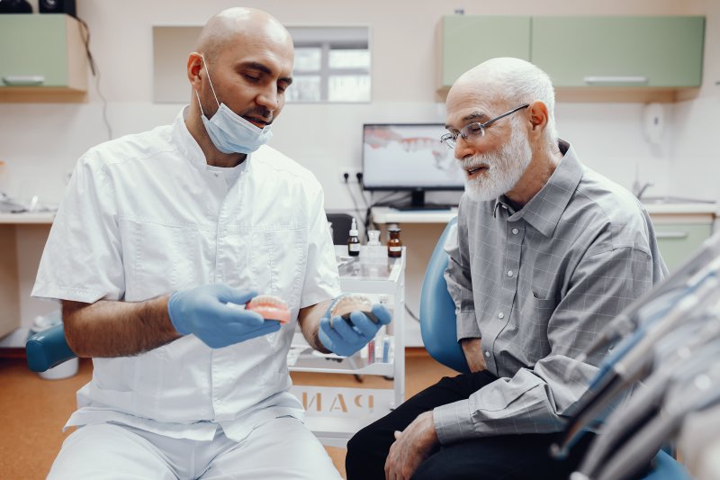 Patient talking to their dentist at their dental checkup