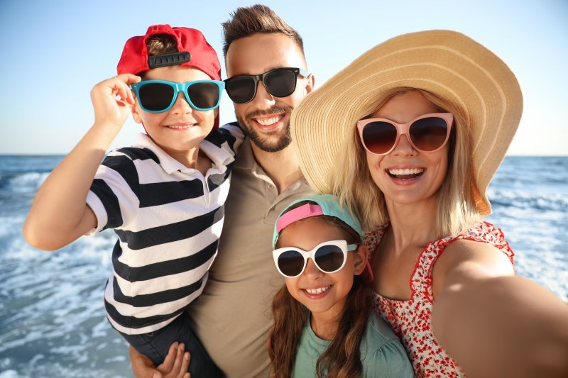 Family playing on the beach