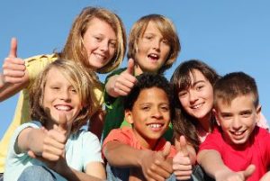 Group of smiling kids in the summer