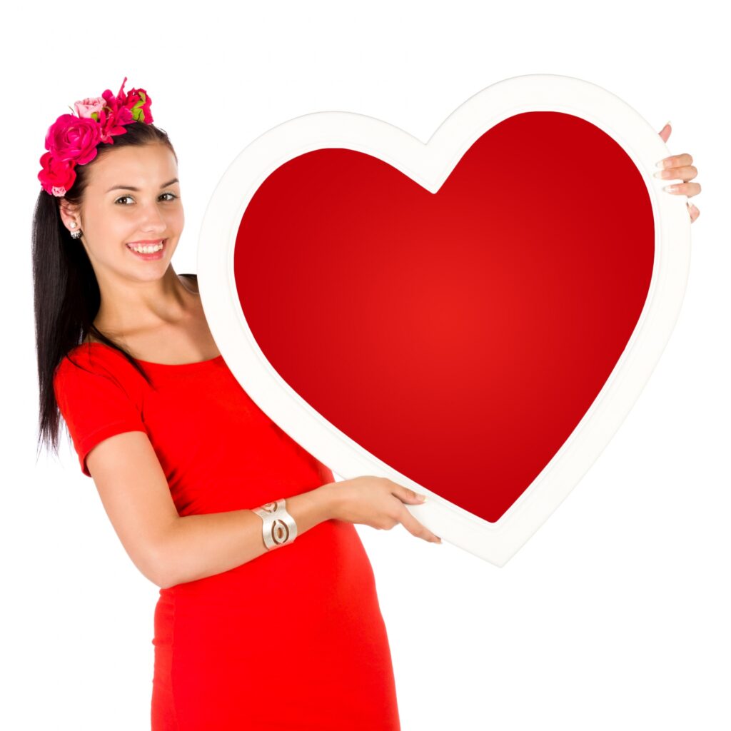 person holding a paper heart